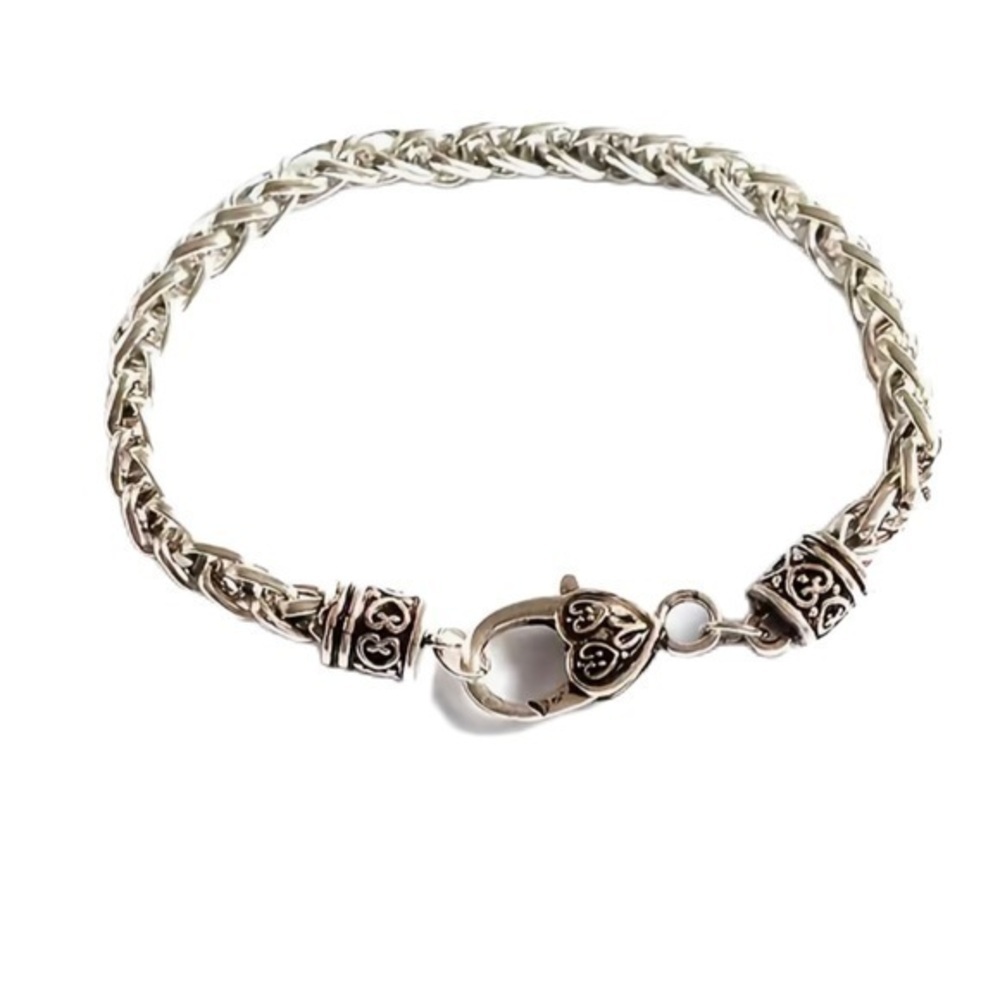 Stainless link bracelet with heart. New